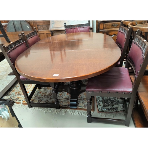 713 - A Jacobean style oak dining suite comprising oval drop leaf table and 6 (4+2) chairs with carved top... 