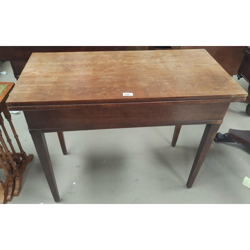 722 - A 19th century mahogany card table with rectangular fold-over top, width 91 cm (no baize lining)