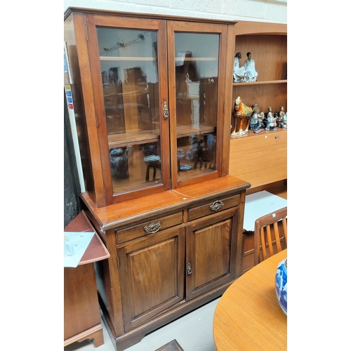 744 - An Edwardian walnut full height bookcase with 2 glazed doors over 2 cupboards and 2 drawers