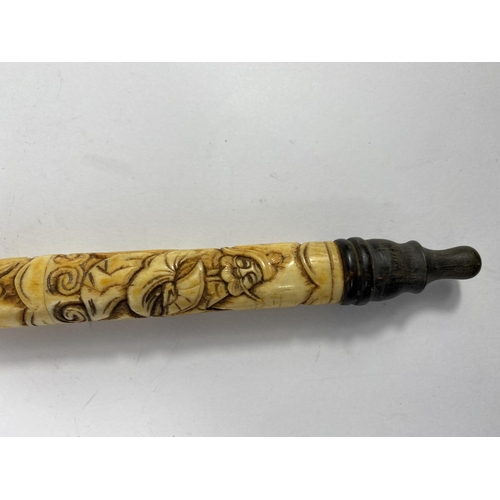331 - A Chinese brass mounted opium pipe, 48 cm; another in carved bone, 47 cm