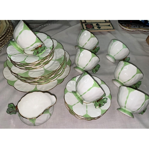 392 - A 1930's Aynsley butterfly part tea service having 7 cups, 10 saucers, 7 side plates, a cake plate a... 