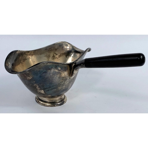 645A - A Swedish white metal double lipped sauce boat with side handle, three crowns mark, 4oz, 130gms.