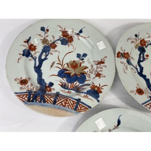 388 - Three 19th century Chinese Imari plates decorated with flowers in blues, reds and gilt; diameter 23c... 