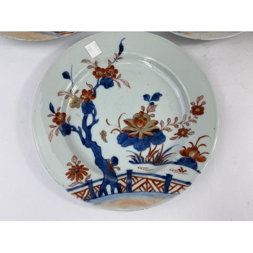 388 - Three 19th century Chinese Imari plates decorated with flowers in blues, reds and gilt; diameter 23c... 