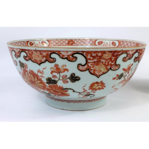 389 - A 19th century Chinese burnt orange bowl with floral decoration; diameter 22.5cm (some wear to glaze... 