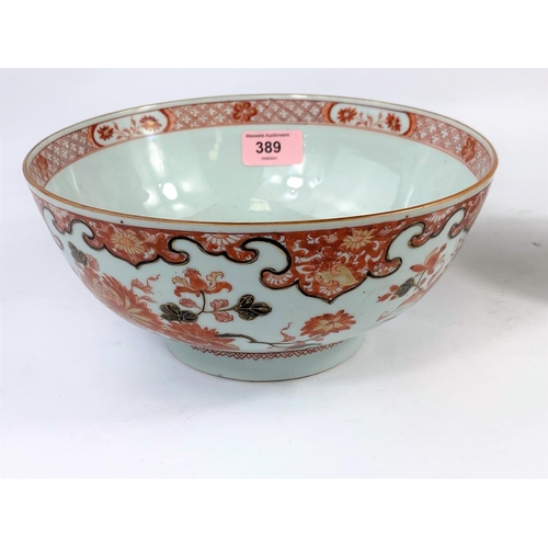 389 - A 19th century Chinese burnt orange bowl with floral decoration; diameter 22.5cm (some wear to glaze... 