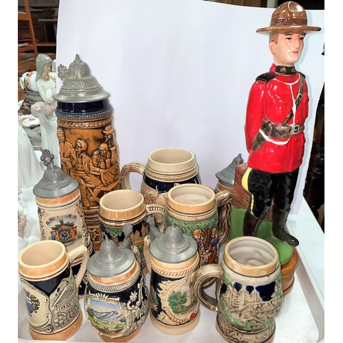 446 - A musical decanter:  Canadian Mountie; a musical stein and 9 others