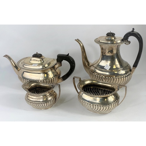 566 - A hallmarked silver 4 piece tea set in the Georgian rounded rectangular style, with gadrooned and fl... 