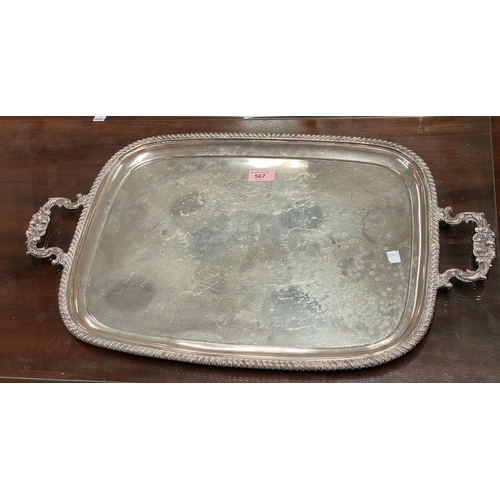 567 - A hallmarked silver large tray of rounded rectangular form, Chester 1913, 82.5 oz 2568 gm