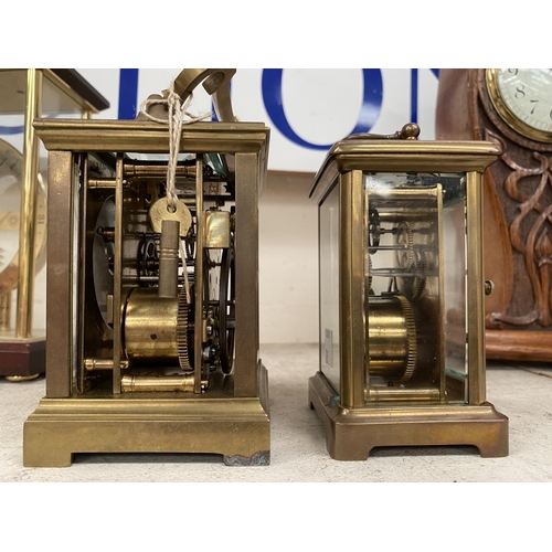 702 - A 19th century brass cased carriage clock striking on gong, height 14 cm (glass side panels missing)... 