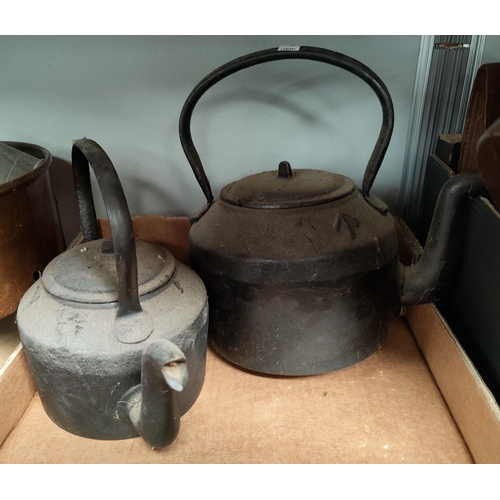11 - A 19th century copper kettle; a brass and 2 cast iron kettles