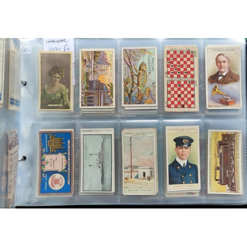 115C - An album of 30 sheets of rarer single cigarette cards etc.