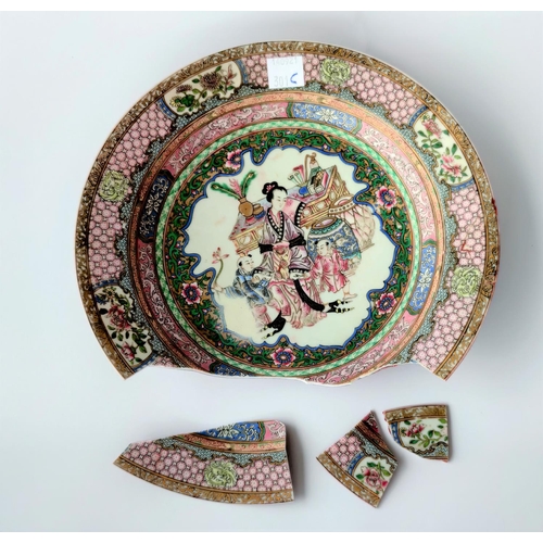 301C - A Chinese porcelain shallow dish with detailed decoration; diameter: 21cm (restored & broken, all pi... 