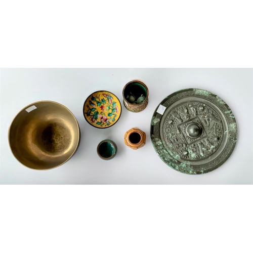 301F - A Chinese bronze mirror and a small selection of metalware