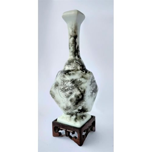 390H - A Chinese ceramic vase of canted square form, with thin neck, decorated in monochrome with a dragon ... 