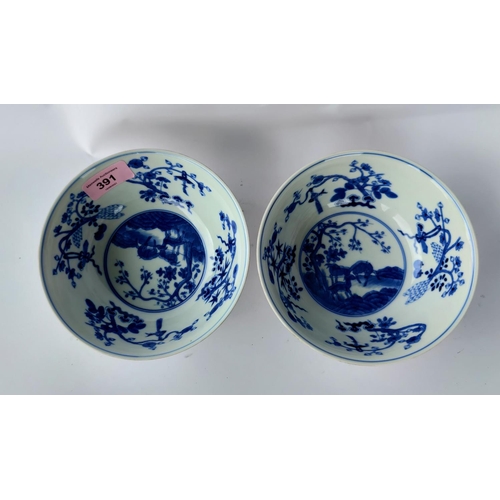 391 - Apair of Chinese yellow glaze bowlswith exterior panels depicting vases and animals, blue and white ... 