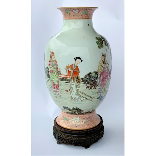 391B - A Chinese baluster vase with a flared rim and scenery depicting a young warrior courting, with red a... 