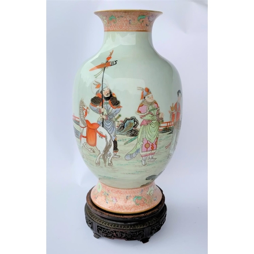 391B - A Chinese baluster vase with a flared rim and scenery depicting a young warrior courting, with red a... 