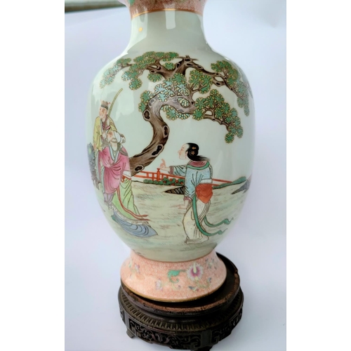 391B - A Chinese baluster vase with a flared rim and scenery depicting a young warrior courting, with red a... 