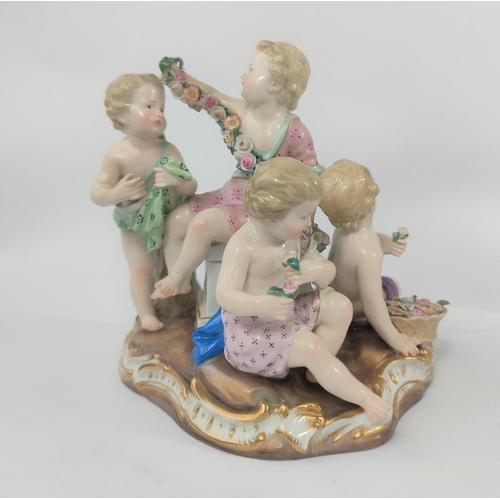 472B - A Meissen ceramic group of 4 cherubs making flower chains, crossed sword marks to base, numbered 250... 
