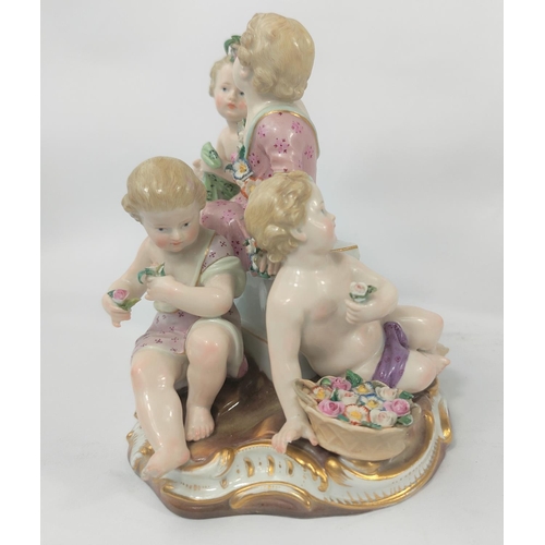 472B - A Meissen ceramic group of 4 cherubs making flower chains, crossed sword marks to base, numbered 250... 