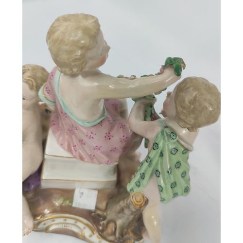 472B - A Meissen ceramic group of 4 cherubs making flower chains, crossed sword marks to base, numbered 250... 