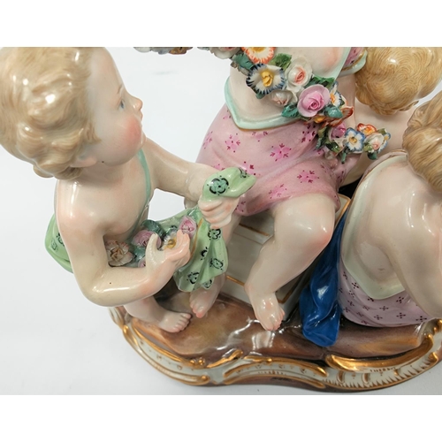 472B - A Meissen ceramic group of 4 cherubs making flower chains, crossed sword marks to base, numbered 250... 