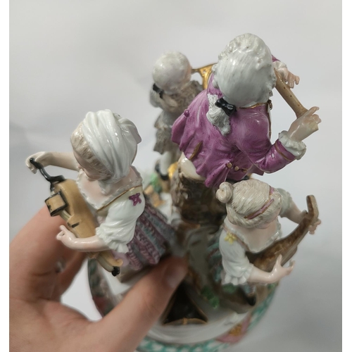 472D - A Meissen figural group centre piece of 4 musicians, 2 males, 2 females attop a pierced stand, cross... 