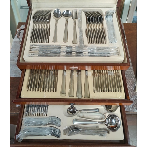 525 - A large canteen of modern stainless steel cutlery by Solingen in 3 height fitted box