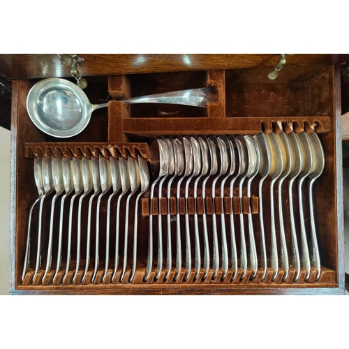 632 - A 1930's oak large canteen of cutlery, beaded edging, four levels of cutlery