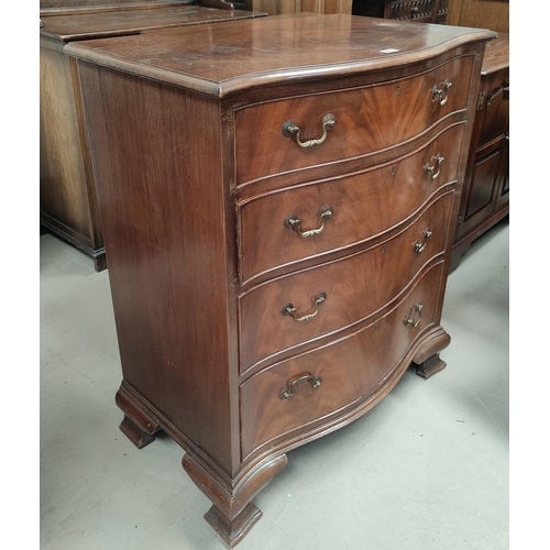 709 - A reproduction figured mahogany 5 height chest of drawers with serpentine front