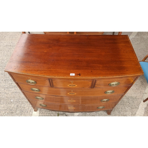 821 - A Georgian mahogany bow fronted chest of 3 long and 3 short drawers with boxwood line and Sheraton s... 