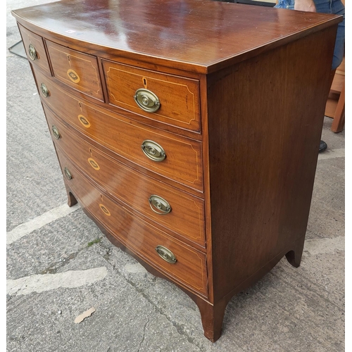 821 - A Georgian mahogany bow fronted chest of 3 long and 3 short drawers with boxwood line and Sheraton s... 