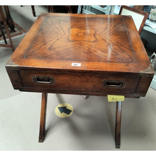 823 - A military style oak occasional / campaign desk with  frieze drawer, brass inset handles and mounts,... 