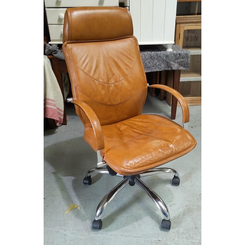 825 - A tubular chrome framed armchair in tan leather