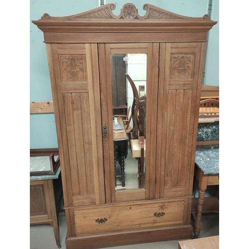 848 - A stripped wood single drawer, mirror door wardrobe, with single drawer to base.