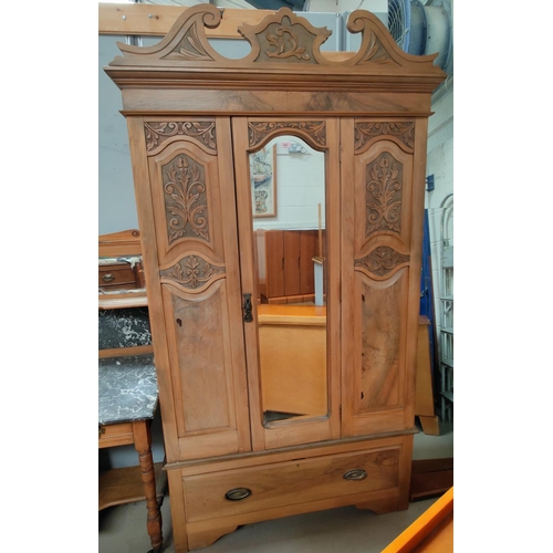 849 - A stripped walnut single mirror door wardrobe, with single drawer to base.