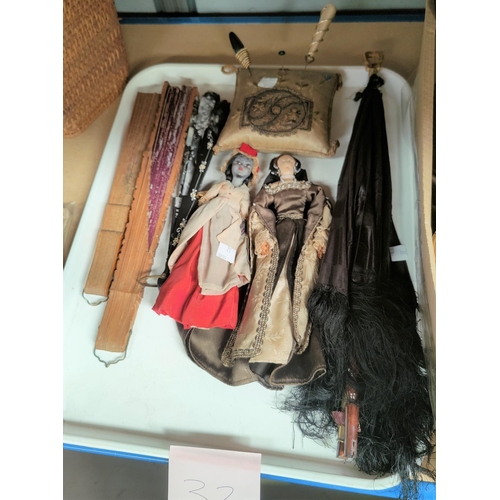 32 - A Victorian black silk parasol; a selection of fans; 2 19th century cloth dolls; a pin cushion