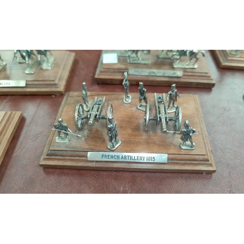 62 - A selection of hall marked silver miniature cavalry and soldiers on wooden plinths, Sheffield 1994; ... 