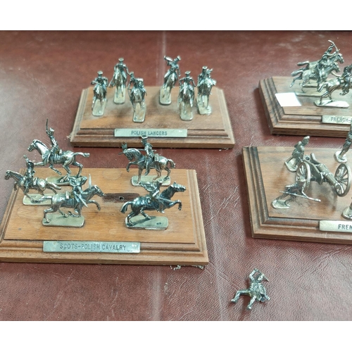 62 - A selection of hall marked silver miniature cavalry and soldiers on wooden plinths, Sheffield 1994; ... 