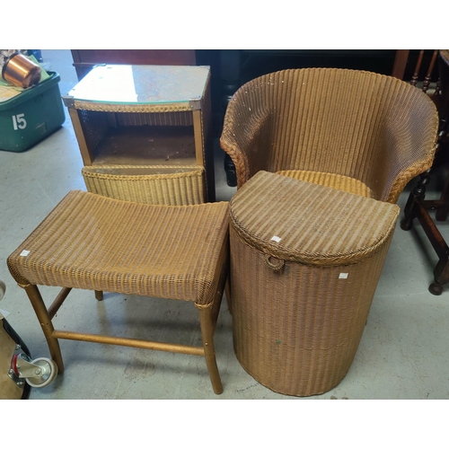 728 - 2 gilt Lloyd Loom armchairs; a Lloyd Loom bedside cabinet, linen basket and stool