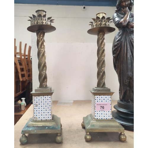 76 - A pair of 19th century rope twst candlesticks with porcelain lower columns, square bases and ball fe... 
