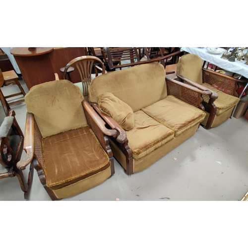 771 - A 1920's/30's 3 piece Bergere suite with golden upholstery, carved and knurled arm rests comprising ... 