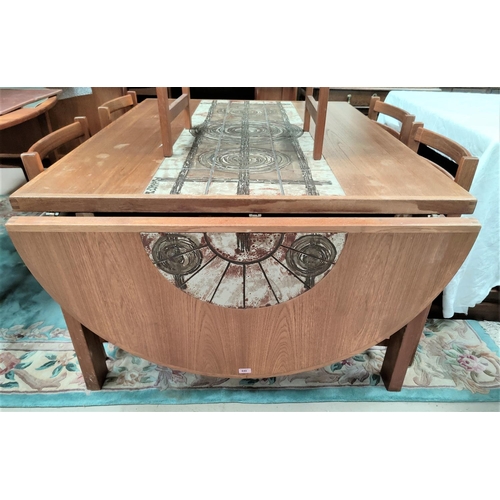 840 - A mid century teak dining suite, the table with a central tiled section of circular design in the ma... 