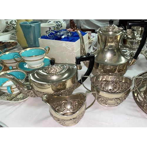 600 - A silver plated 4 piece tea set in the Georgian oval style with embossed decoration