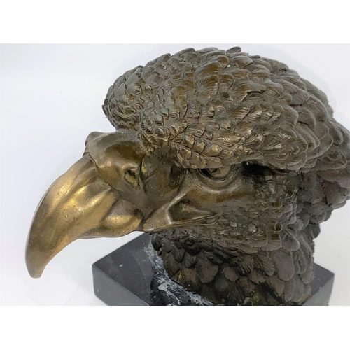 100 - A 20th century animalier style wall hanging bronze, depicting an Eagle's head on a black marble plin... 