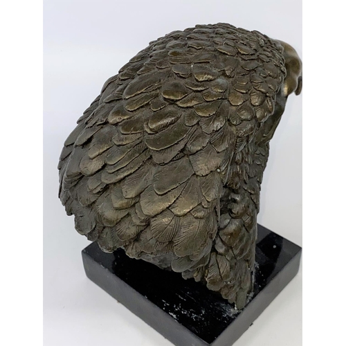 100 - A 20th century animalier style wall hanging bronze, depicting an Eagle's head on a black marble plin... 