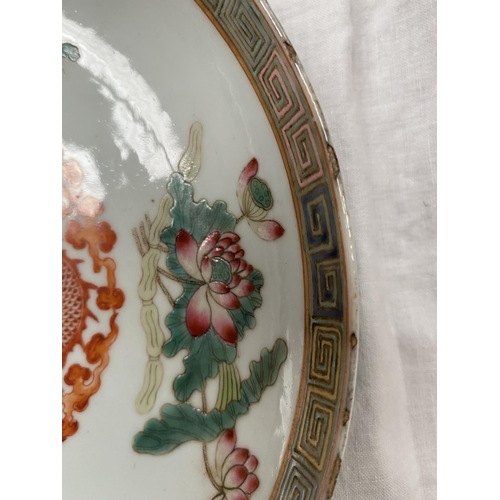 354 - 2 Chinese dishes decorated with central dragon, both with 6 character to base, polychrome decoration... 