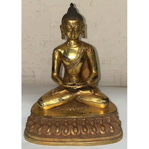 361 - A Chinese bronze gilded figure of a buddha in lotus position, ht. 23cm