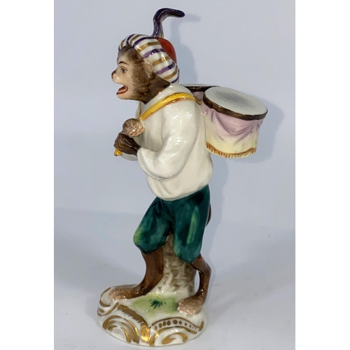 401C - A German porcelain Monkey Band figure of a drummer, 12cm.